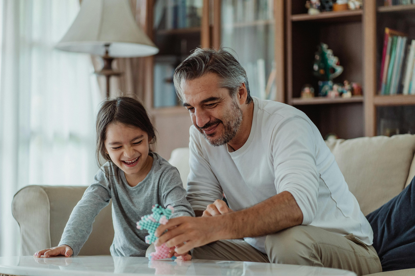 man and child laughing