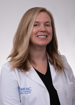 Lauren Pearce, FNP, Hematology, wearing a white coat