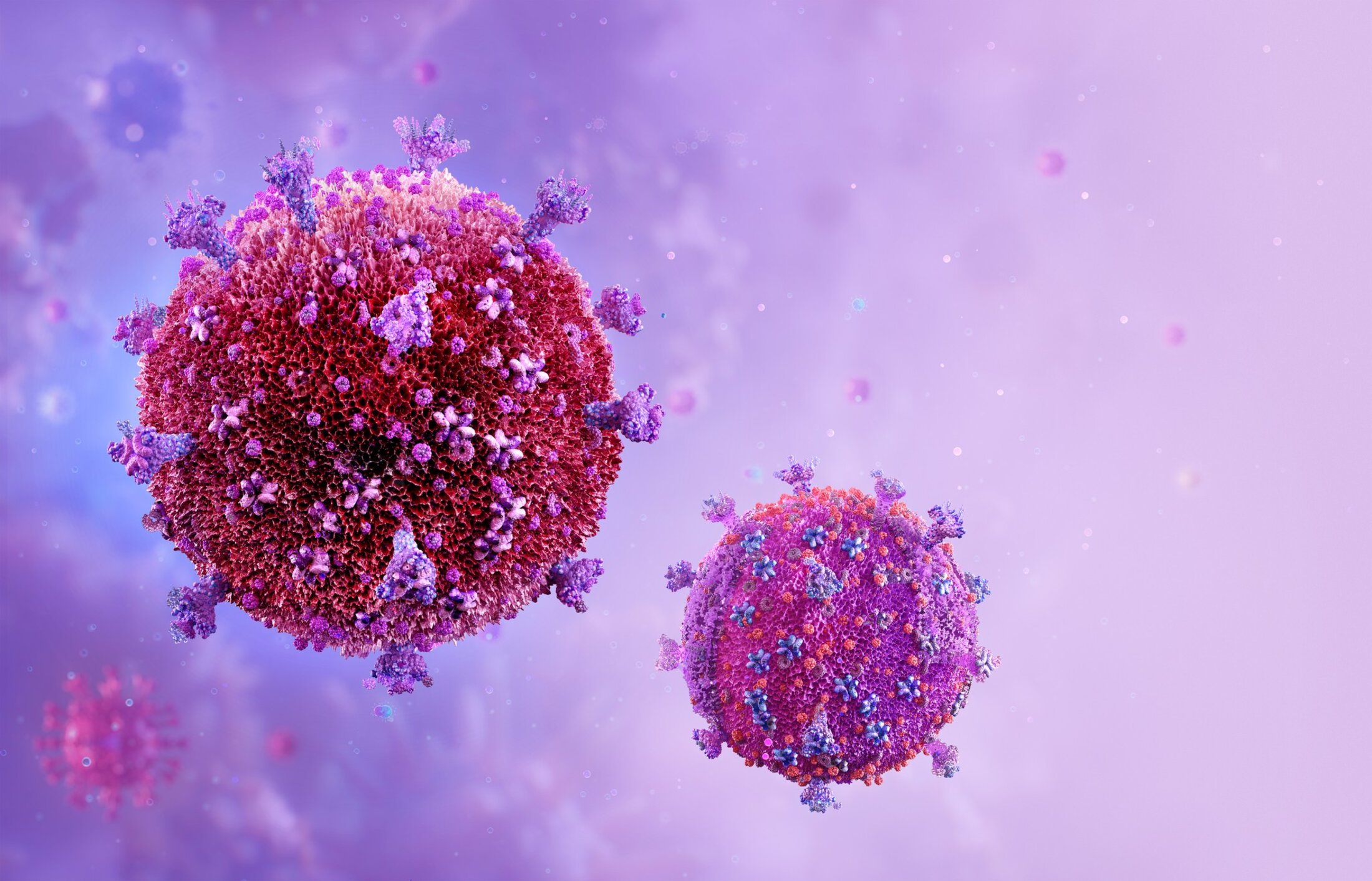 Two reddish pink balls on a lavendar background. The balls haev purple, pink and blue spikes coming out of them.