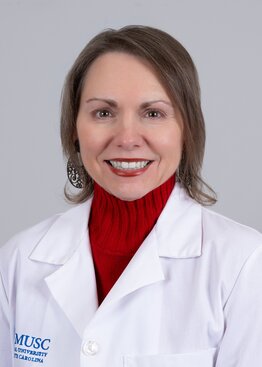 Amy Martin wearing a white coat