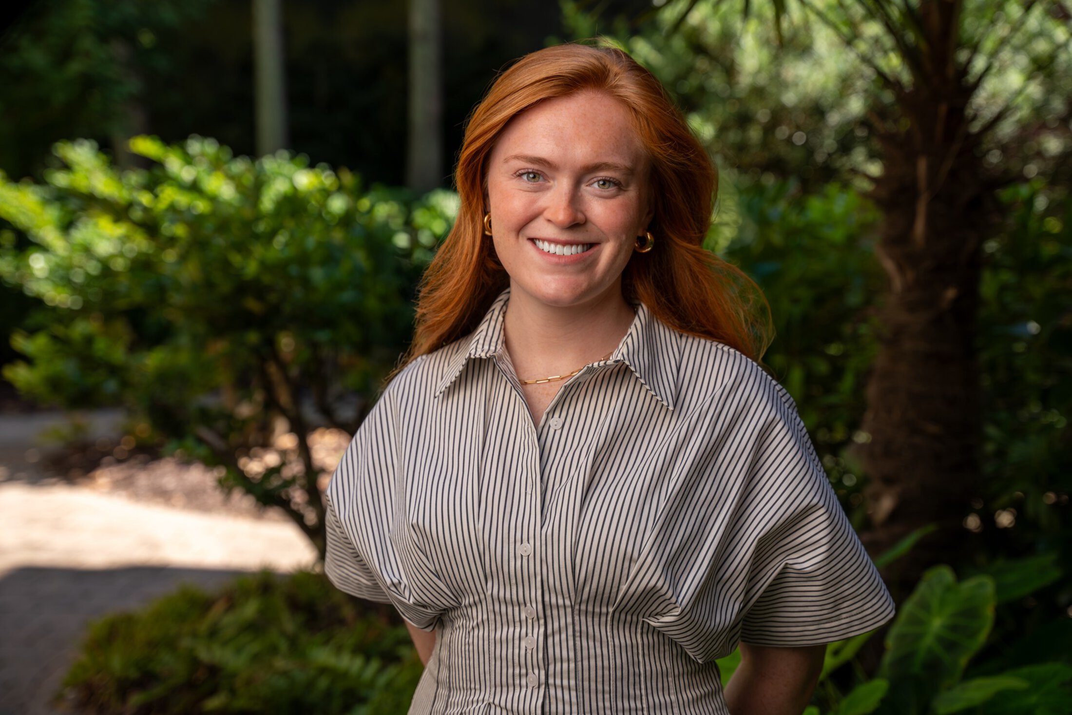 Merritt McDonald headshot in a garden.