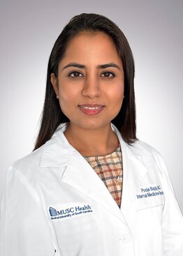 Pooja Bajaj Internal Medicine MD wearing a white coat