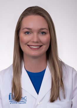 Jessica English Assistant Professor, Division of Rheumatology and Immunology Department of Medicine wearing a white coat