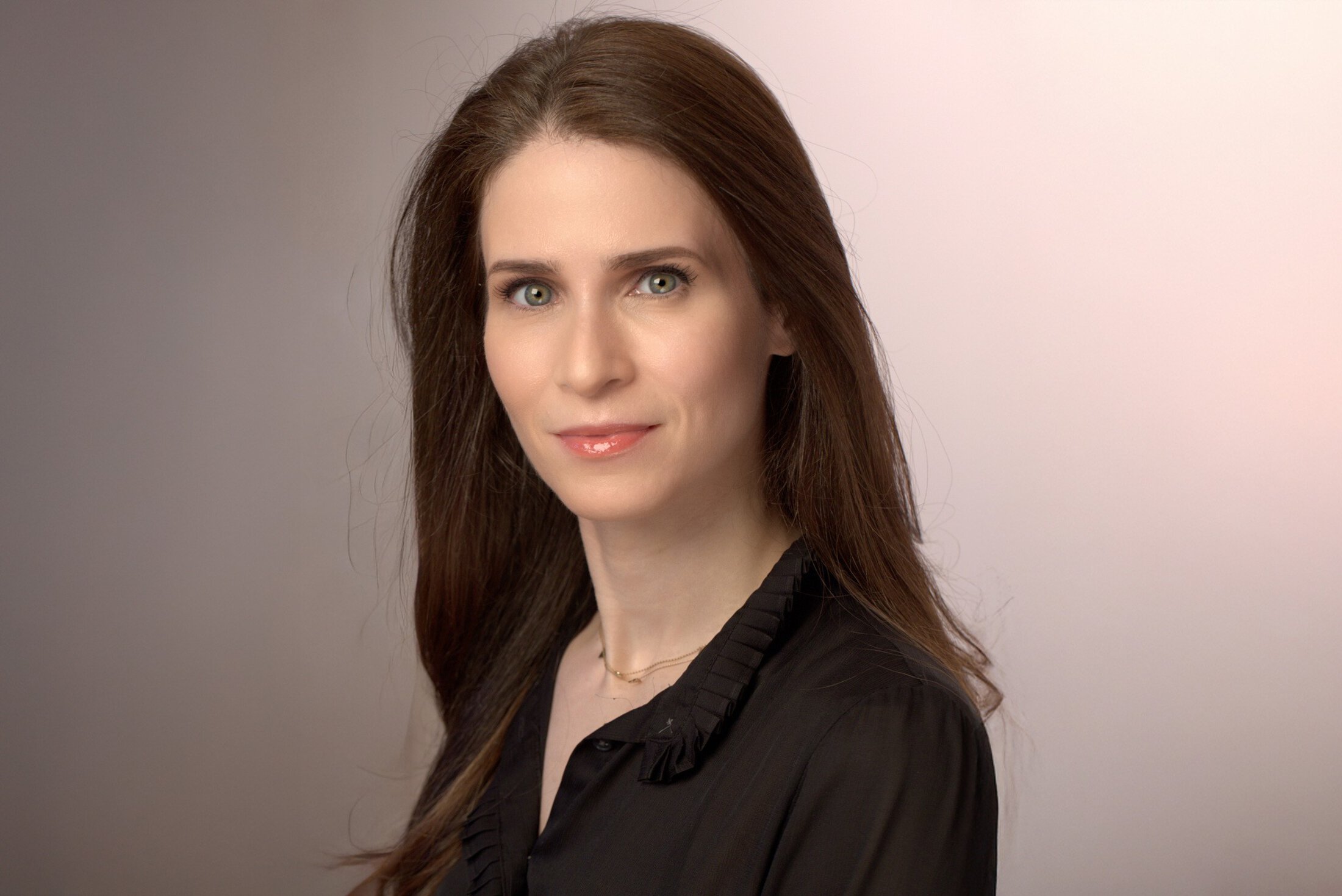 headshot of Allison Applebaum in a black blouse