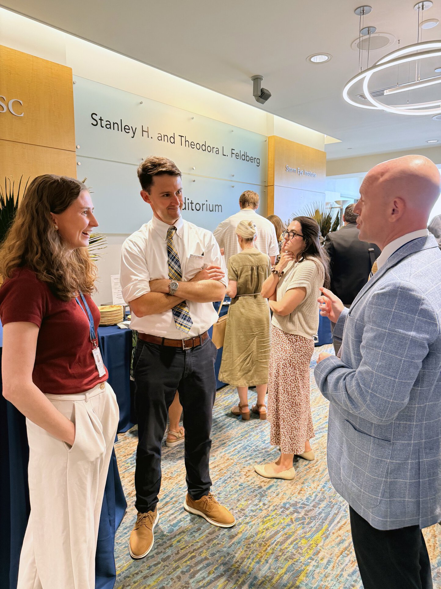 Dr. Hencelmann enjoying a conversation during the Innovation Day reception.