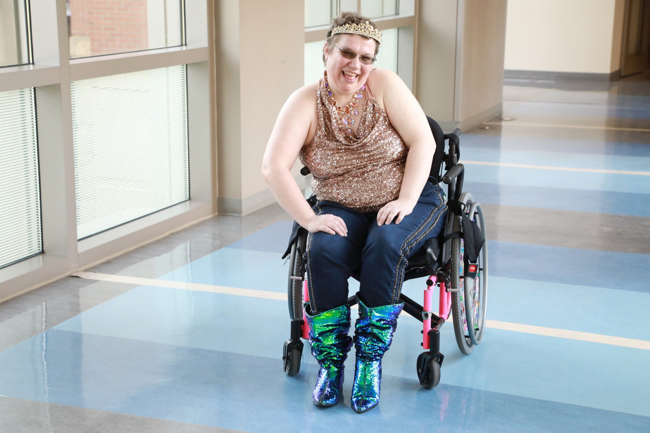 Person smiling in a wheelchair.