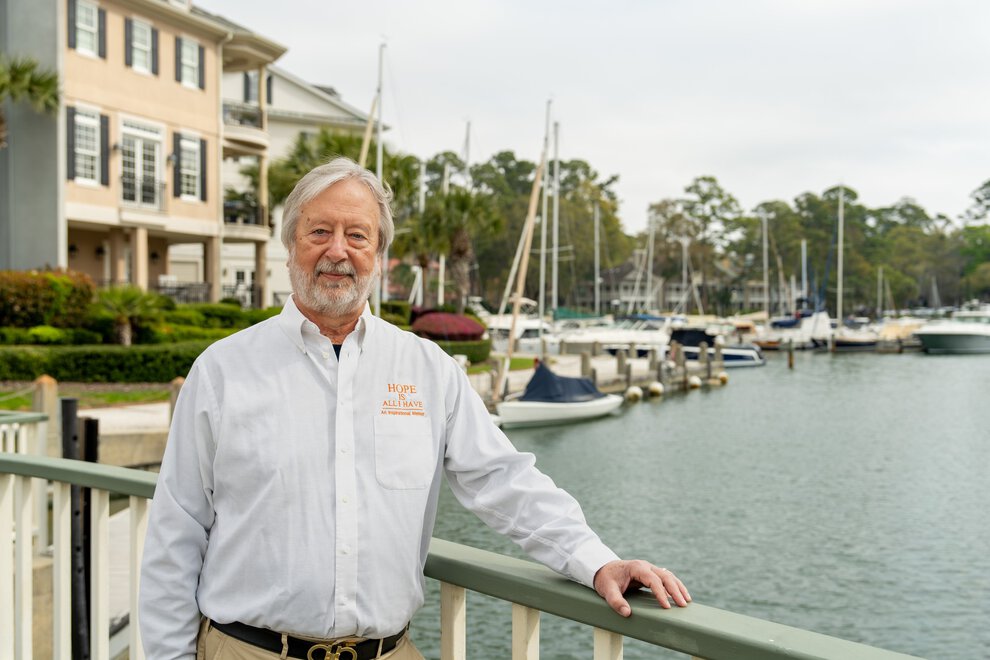 Billy Douglas in front of the neighborhood marina.