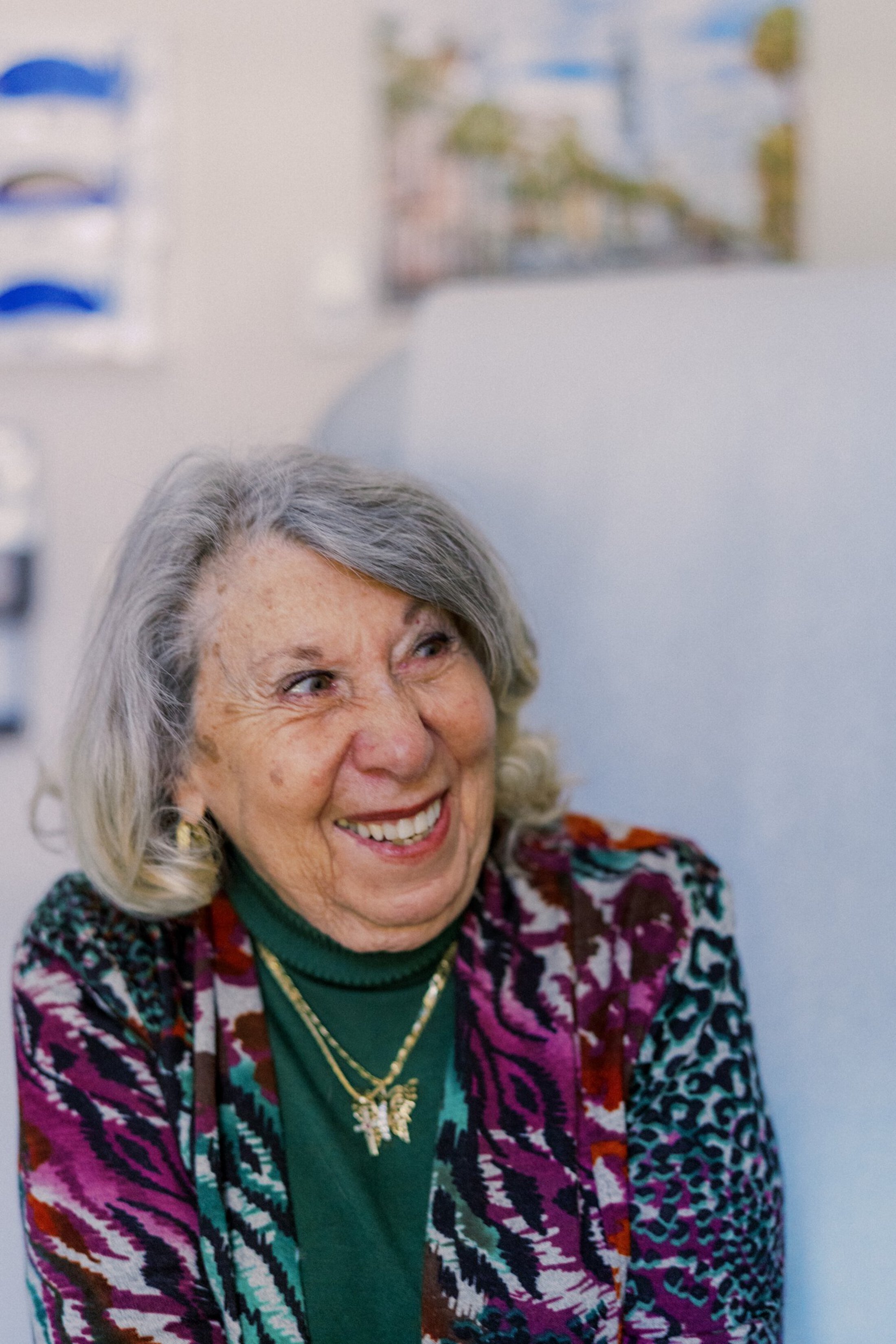Patient smiles at doctor during appointment.