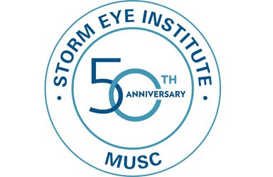 White background. Two blue circles, one inside the other. The words Storm Eye Institite. 50th anniversary. MUSC