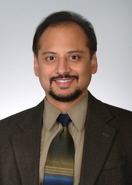 Sameer Tipnis, Medicine, PhD, Professor wearing a suit