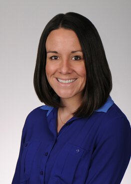 Leslie Bell, Regulatory Lead wearing a blue shirt