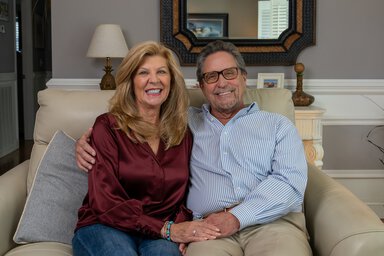 Steve Olsen Hollings Cancer Center sitting on couch