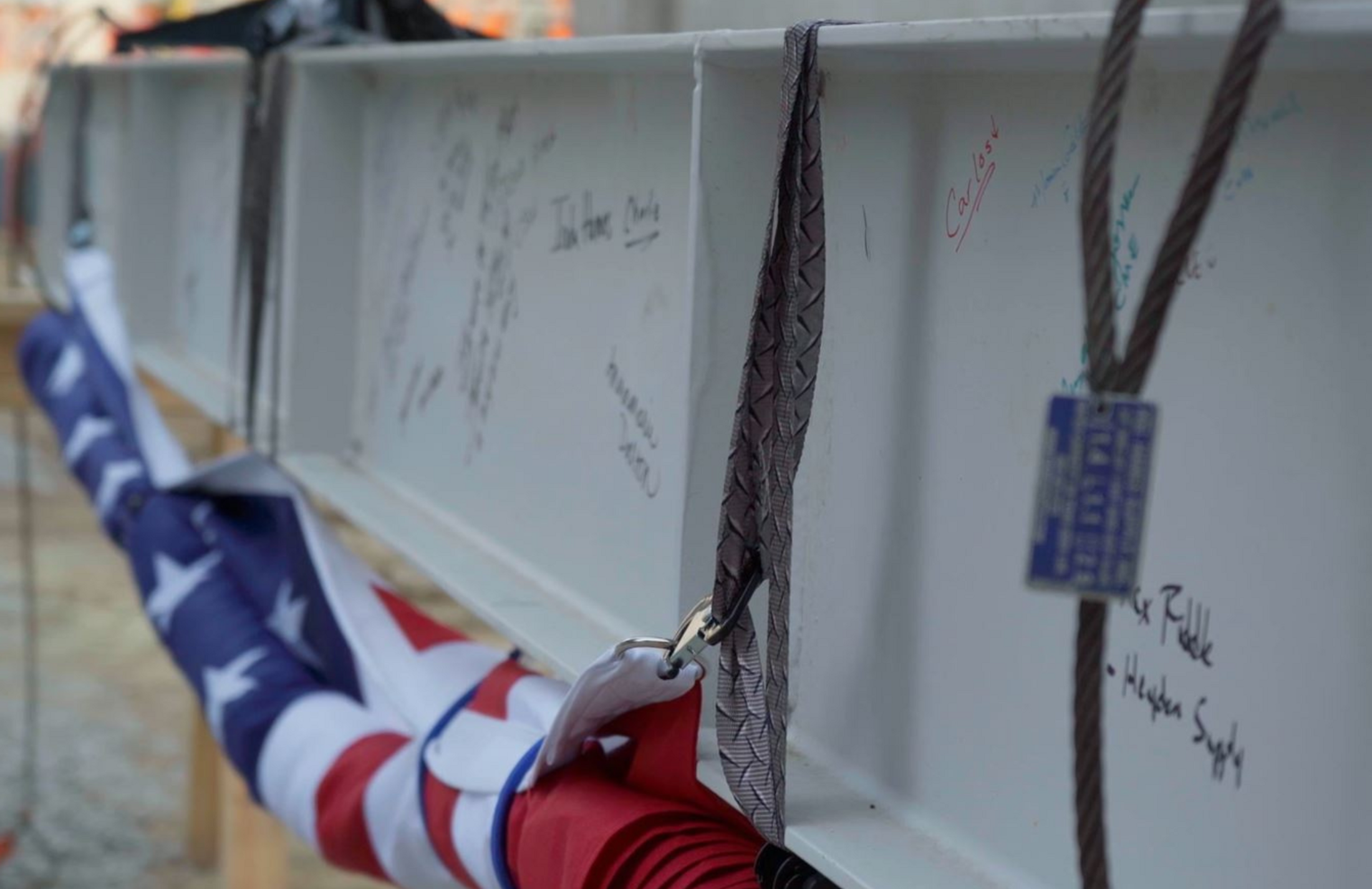 Metal beam with signatures.