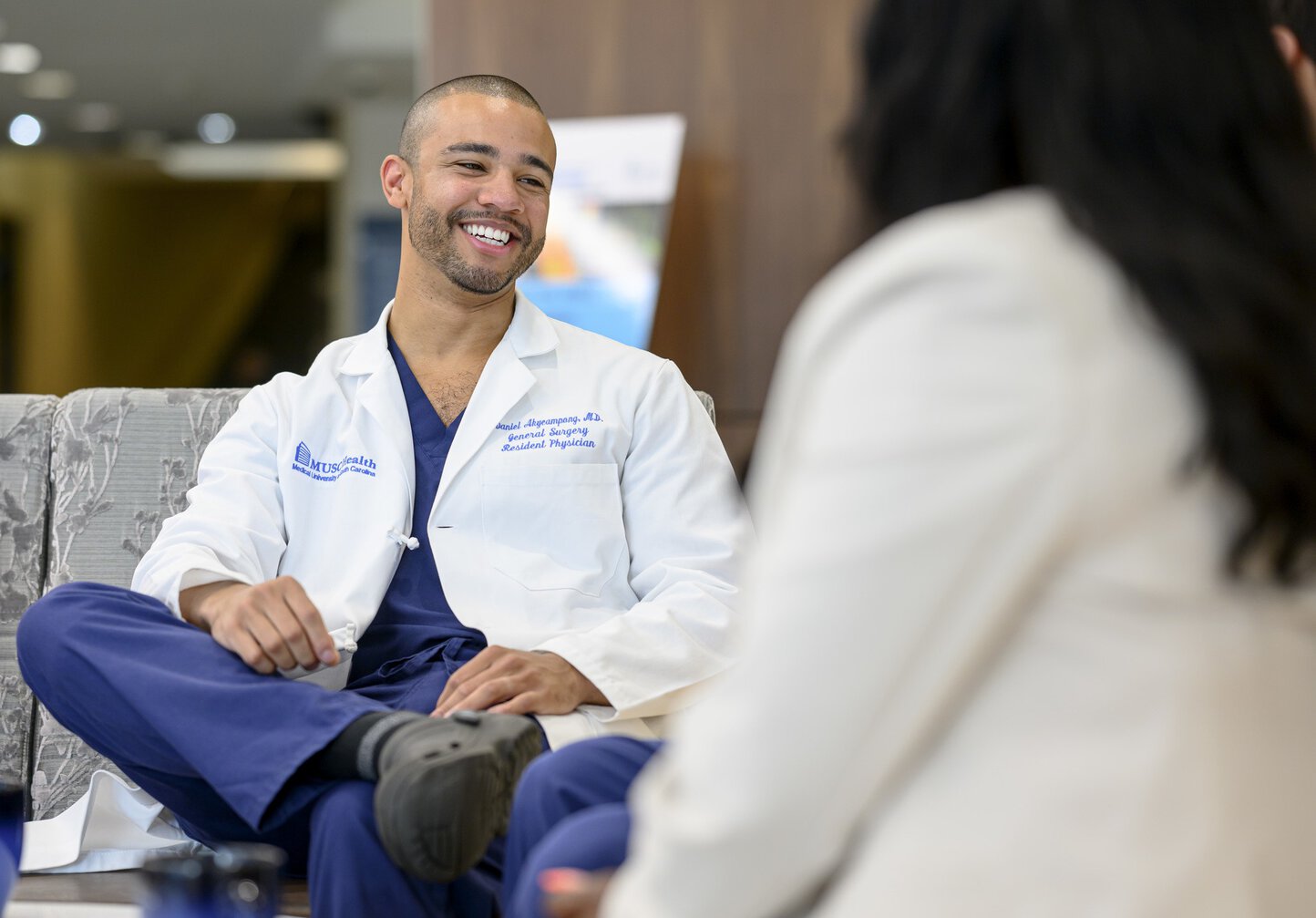 General Surgery resident Daniel Akyeampong, M.D. takes a few minutes to chat with a colleague.