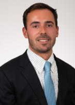 Joshua Lucas, fellow wearing a suit