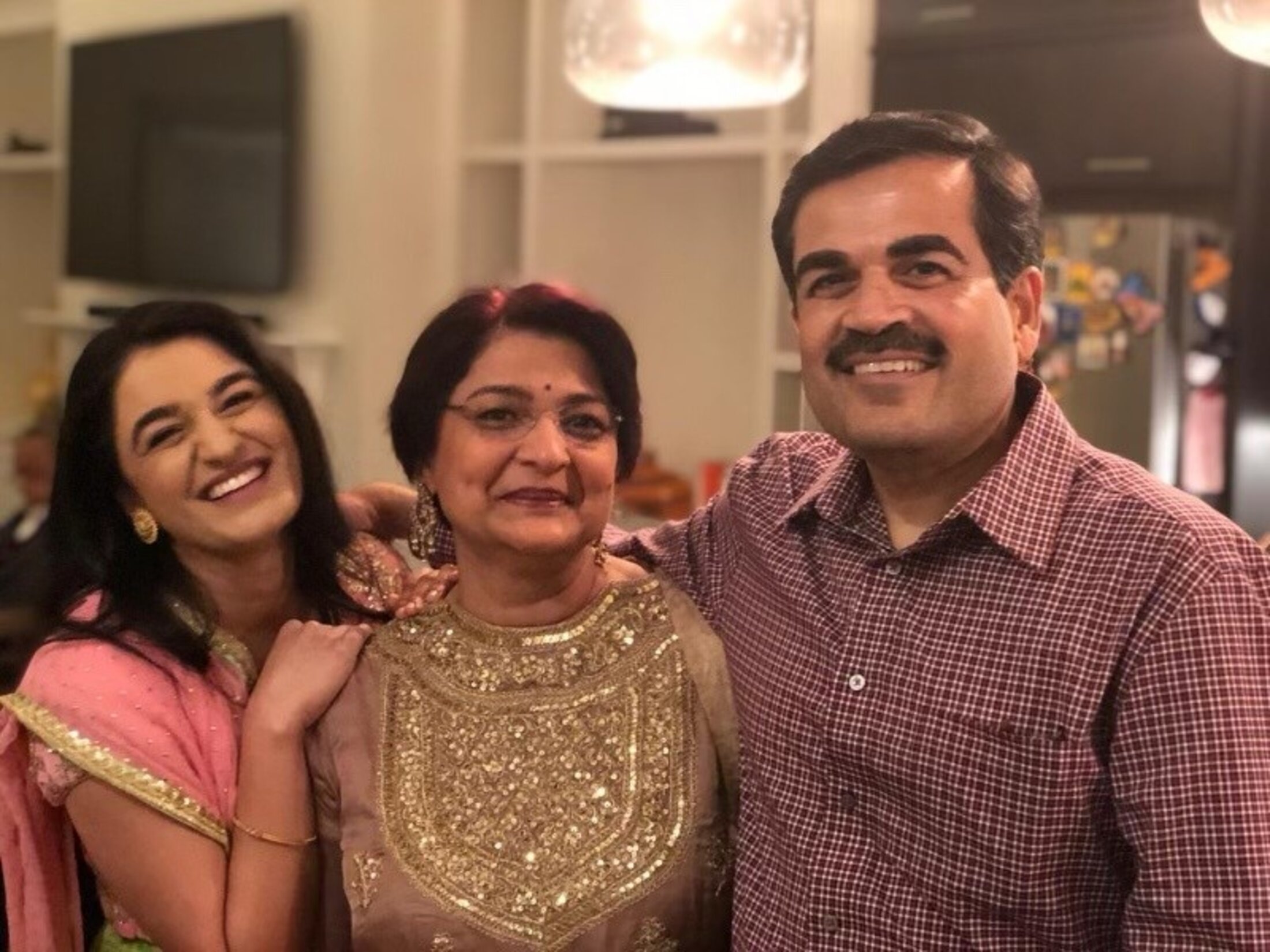 Dr. Zoher Kapasi, right, with his wife, Manisha, center, and daughter, Saayna, left.
