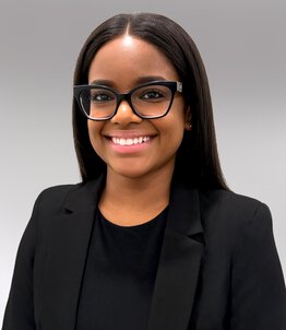 Chinieka Jackman Rogers, MHA, RDH wearing a black suit