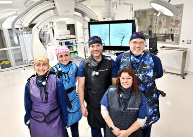 The team poses after their first MMA embolization procedure.