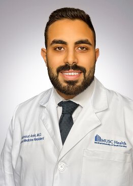 Mahmoud Amin  MD Internal Medicine wearing a white coat