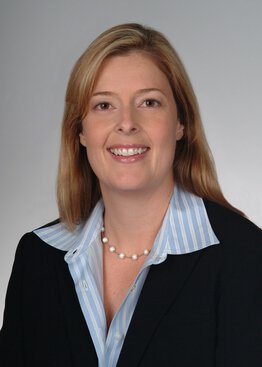 Annie Simpson, Medicine, PhD, Adjunct Professor wearing a sport coat and dress shirt